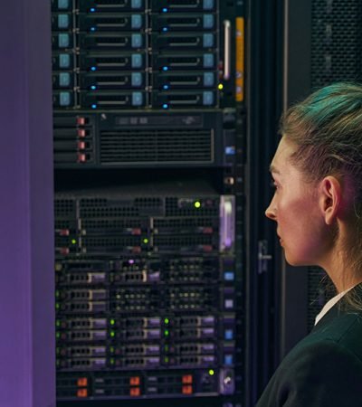 professional-young-woman-working-in-server-room-2024-10-18-08-37-11-utc